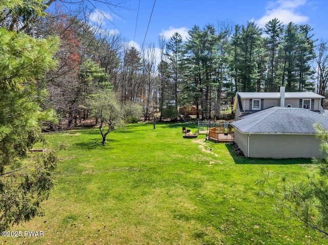 view of yard featuring a wooden deck