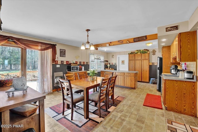 dining space with stone finish floor