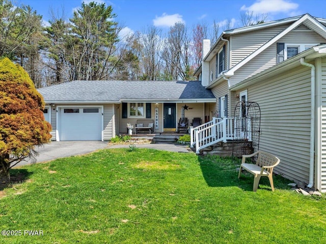 traditional-style home with a front lawn, aphalt driveway, a chimney, an attached garage, and a porch