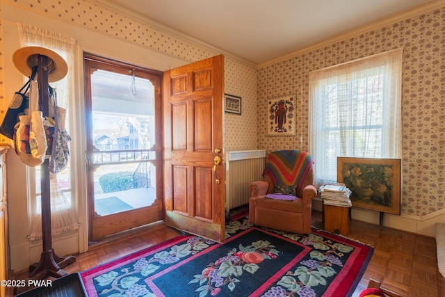 interior space with dark parquet flooring and crown molding