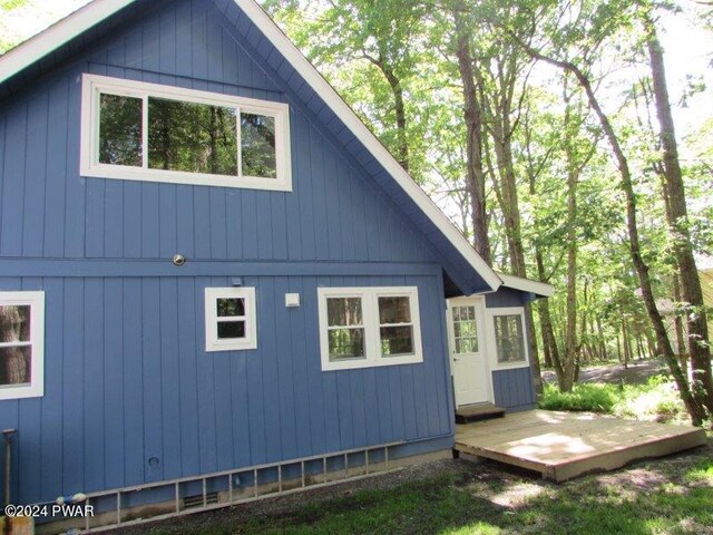 view of side of home with a deck