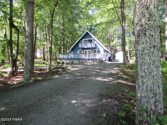 view of front facade with a wooden deck