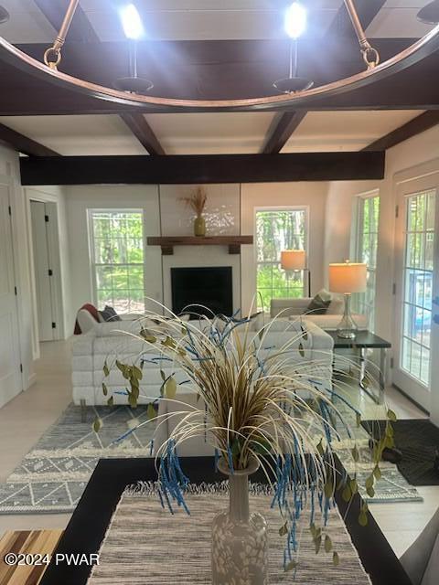 living room featuring beam ceiling