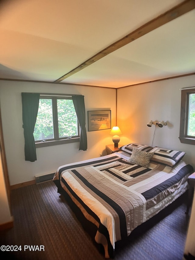 bedroom featuring beam ceiling