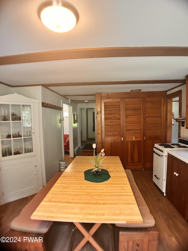 dining room with dark hardwood / wood-style floors