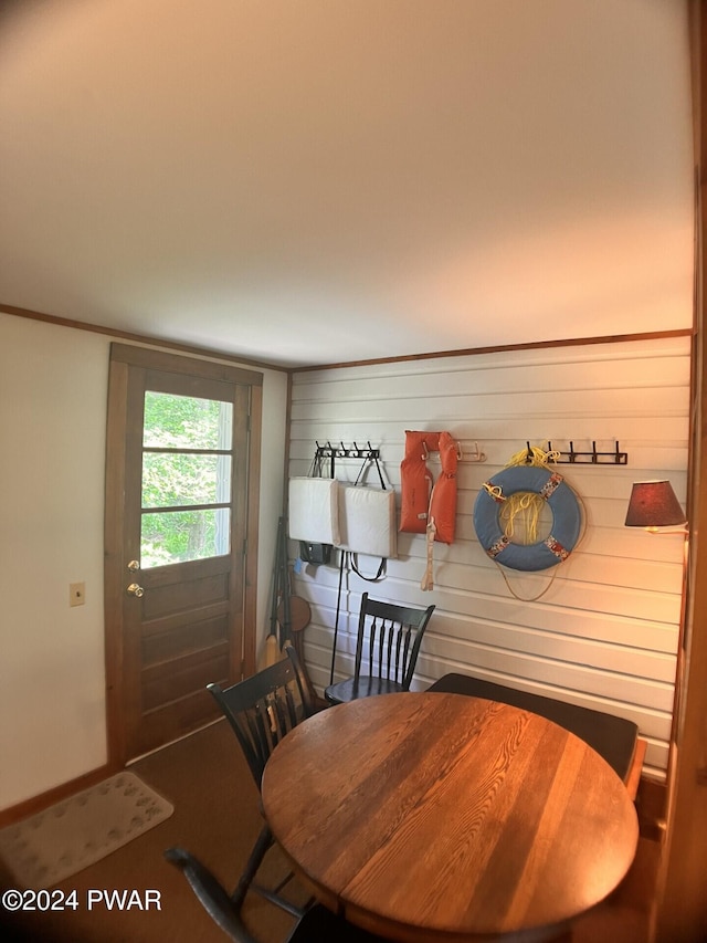 dining area with wood walls