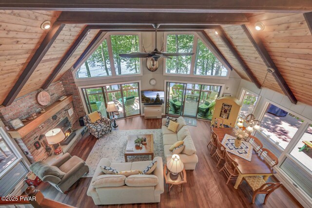 37 Rockpoint Ct, Lake Ariel, PA 18436 - living room featuring a wooden ceiling with exposed beams, wood finished floors, high vaulted ceiling, a brick fireplace, and ceiling fan