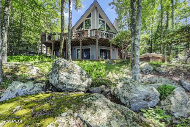 37 Rockpoint Ct, Lake Ariel, PA 18436 - back of property with a deck and a chimney