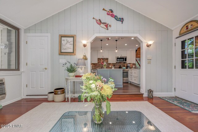 37 Rockpoint Ct, Lake Ariel, PA 18436 - living area with vaulted ceiling, dark wood-type flooring, arched walkways, and a decorative wall