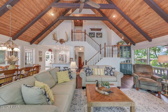 37 Rockpoint Ct, Lake Ariel, PA 18436 - living room featuring a wooden ceiling with exposed beams, high vaulted ceiling, wood finished floors, a chandelier, and stairs