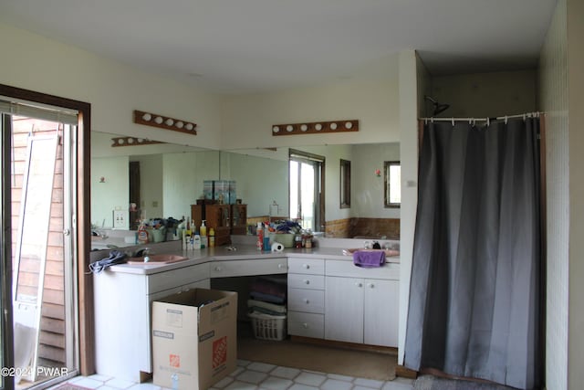 bathroom featuring vanity and walk in shower