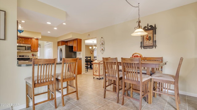 dining space featuring light tile patterned floors, baseboards, a chandelier, and recessed lighting
