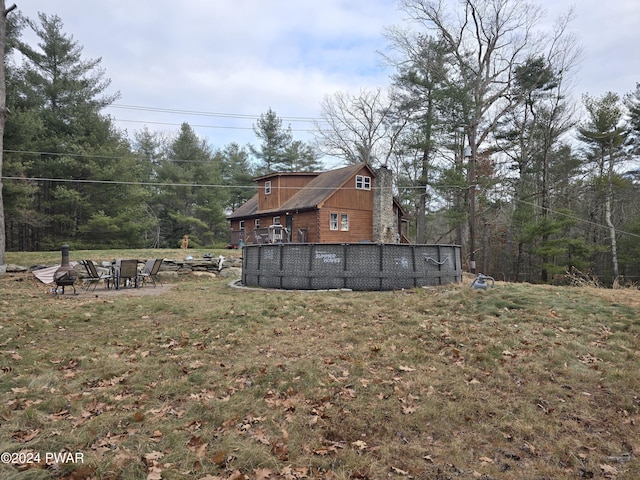 view of yard with an outdoor fire pit