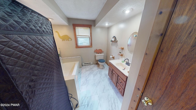 bathroom with a bathing tub, vanity, toilet, and a textured ceiling