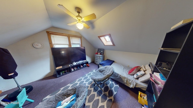 interior space featuring carpet floors, lofted ceiling with skylight, and ceiling fan