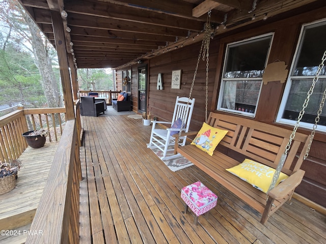 deck featuring outdoor lounge area