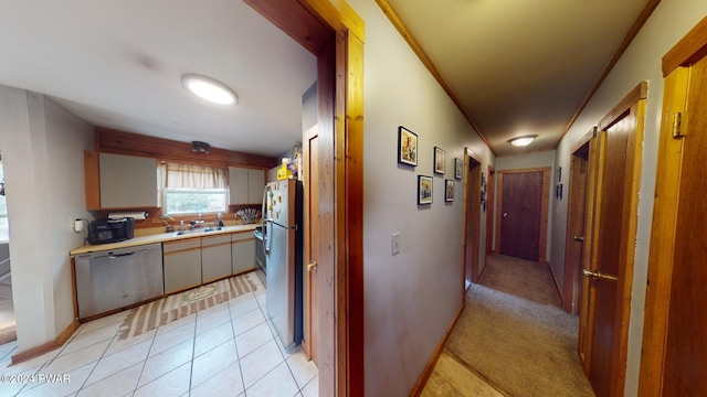 hallway with light colored carpet and sink