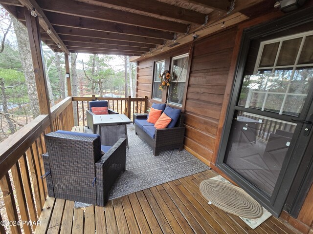 wooden deck featuring an outdoor living space