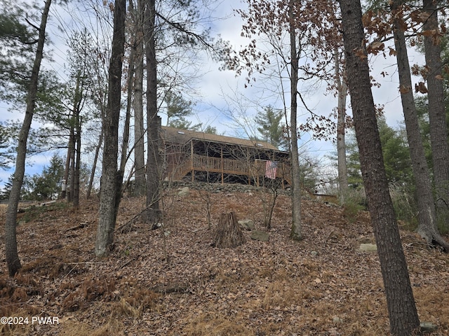 back of house featuring a deck