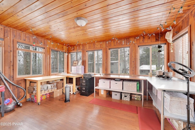 sunroom / solarium featuring wooden ceiling and plenty of natural light