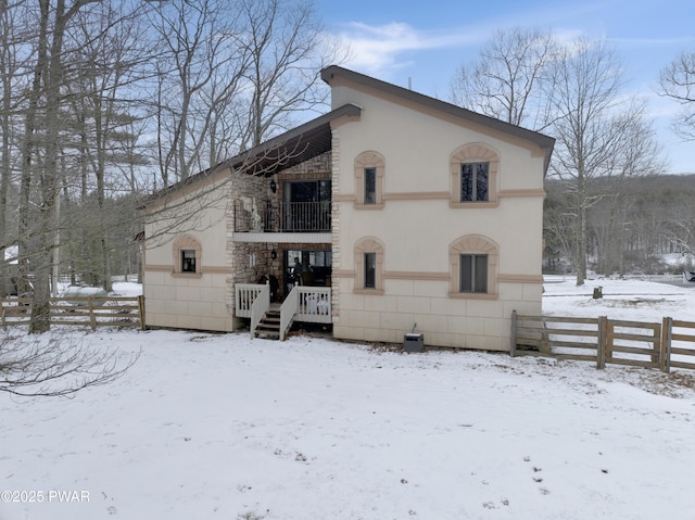 exterior space with fence and stucco siding