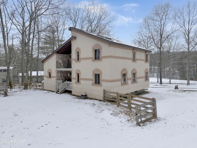 exterior space featuring central air condition unit and stucco siding