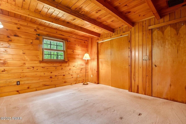349 Starlight Lake Rd, Starlight, PA 18461 - unfurnished bedroom featuring carpet, wood ceiling with exposed beams, and wood walls