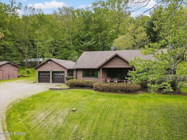 349 Starlight Lake Rd, Starlight, PA 18461 - view of front of property featuring a front lawn, driveway, a garage, a shingled roof, and a forest view