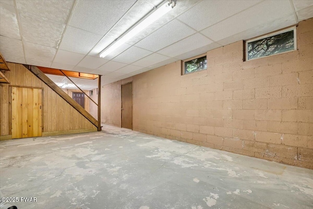 349 Starlight Lake Rd, Starlight, PA 18461 - below grade area with stairs, concrete block wall, and a paneled ceiling