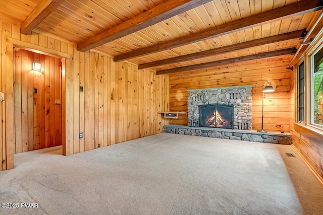 349 Starlight Lake Rd, Starlight, PA 18461 - unfurnished living room with carpet, wood ceiling with exposed beams, wood walls, and a fireplace