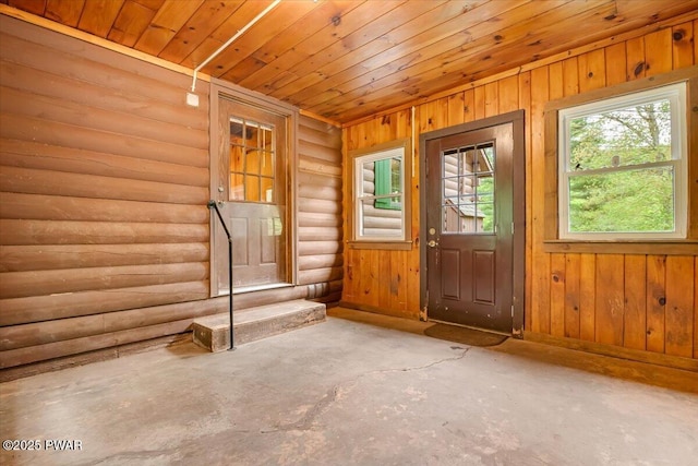349 Starlight Lake Rd, Starlight, PA 18461 - entrance foyer with concrete floors, wood ceiling, baseboards, and rustic walls