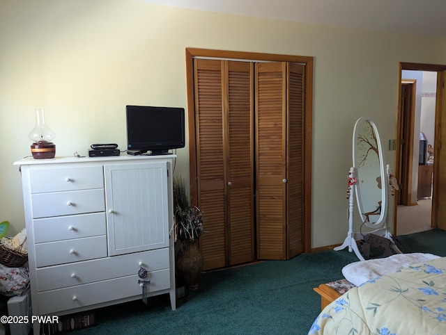 bedroom with dark colored carpet and a closet