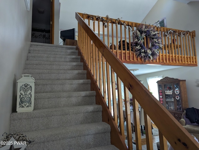 staircase with a high ceiling