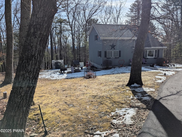 view of front of home featuring a shingled roof