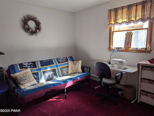 office area with a baseboard heating unit and carpet