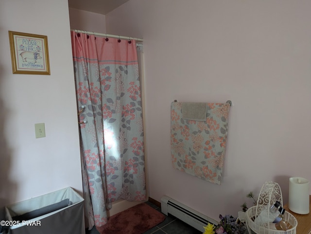 bathroom with a shower with curtain, a baseboard radiator, and tile patterned floors