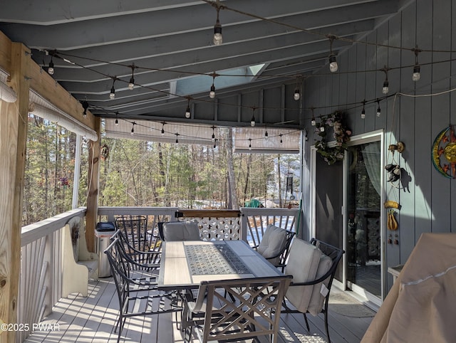 wooden terrace with outdoor dining area