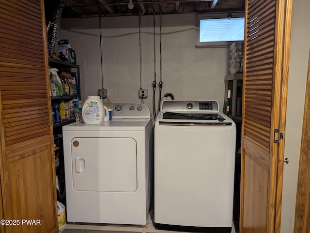 washroom featuring laundry area and washer and dryer