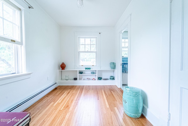 111 W High St, Milford, PA 18337 - empty room featuring a baseboard radiator and wood finished floors