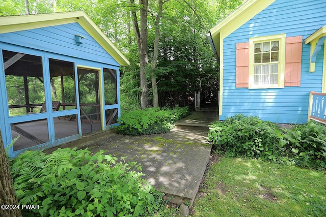 view of yard featuring a sunroom