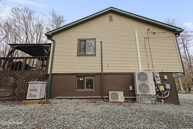 104 Rockway Rd, Lake Ariel, PA 18436 - view of property exterior with ac unit, stucco siding, and a deck
