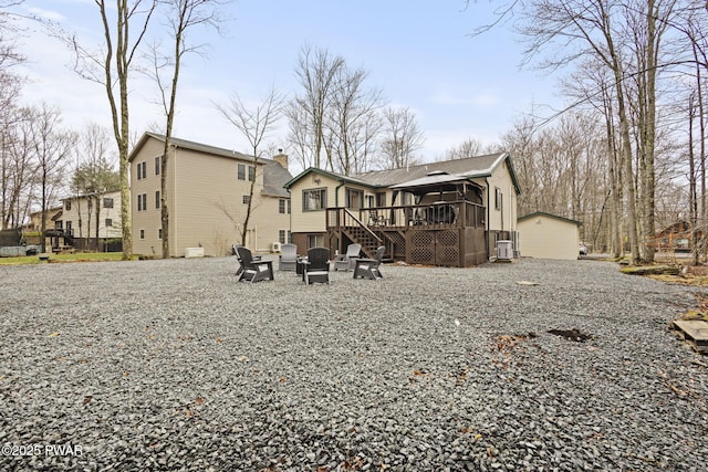 104 Rockway Rd, Lake Ariel, PA 18436 - back of house with a wooden deck, stairs, a sunroom, and a chimney