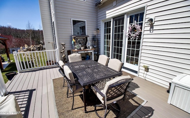 wooden deck with outdoor dining space