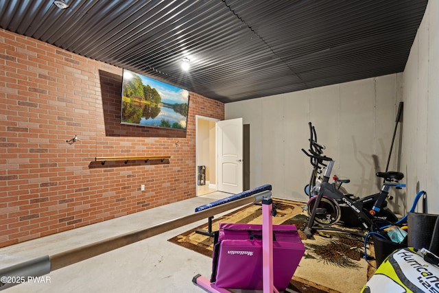 workout room with brick wall