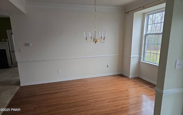 1712 Big Ridge Dr, East Stroudsburg, PA 18302 - unfurnished dining area featuring crown molding, baseboards, an inviting chandelier, and light wood-style floors