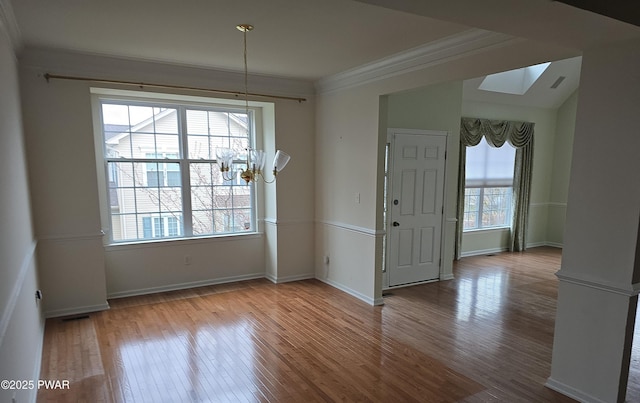 1712 Big Ridge Dr, East Stroudsburg, PA 18302 - unfurnished dining area with crown molding, wood finished floors, a chandelier, and a skylight