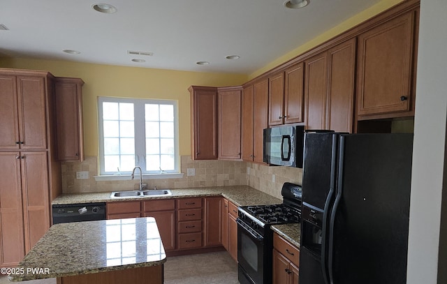 1712 Big Ridge Dr, East Stroudsburg, PA 18302 - kitchen with a kitchen island, recessed lighting, tasteful backsplash, a sink, and black appliances