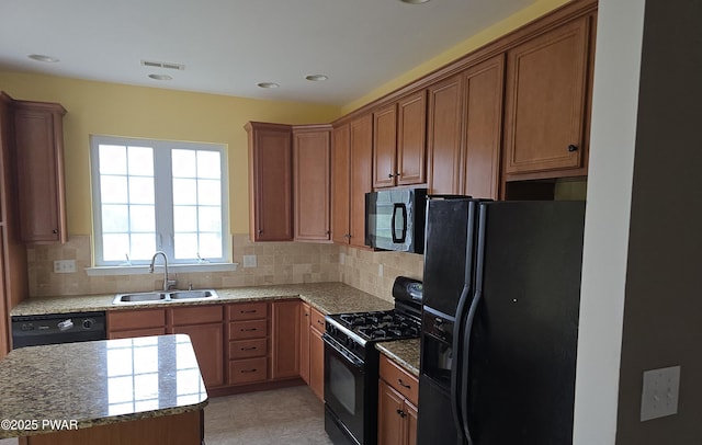1712 Big Ridge Dr, East Stroudsburg, PA 18302 - kitchen featuring visible vents, a sink, decorative backsplash, and black appliances