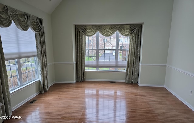 1712 Big Ridge Dr, East Stroudsburg, PA 18302 - empty room with baseboards, visible vents, wood finished floors, and vaulted ceiling