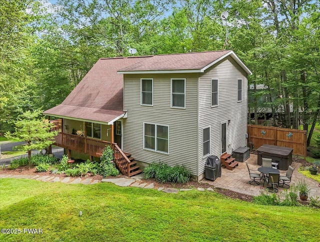 111 Sun Valley Dr, Tafton, PA 18464 - rear view of property featuring a patio, a hot tub, and roof with shingles